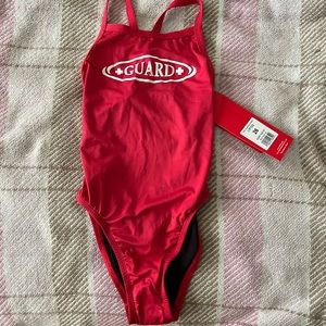 Lifeguard one piece. Never worn, new with tags! Size 26. Perfect condition!